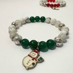 Festive handmade Beaded Bracelet set with Christmas snowman and stocking Charms.